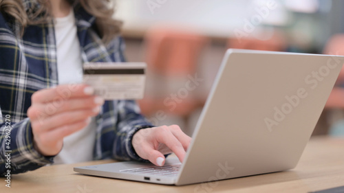 Female Hands doing Online Shopping on Laptop, Close up