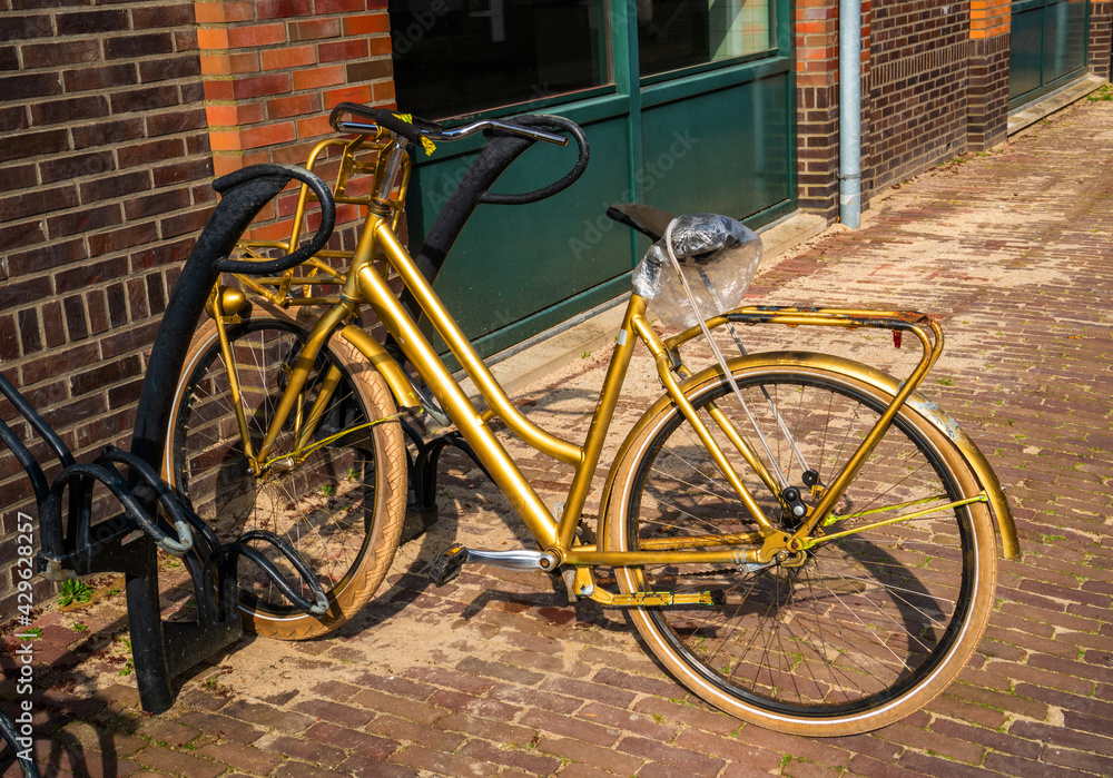 Close up of a gold colored bicycle
Close up of a gold colored bicycle