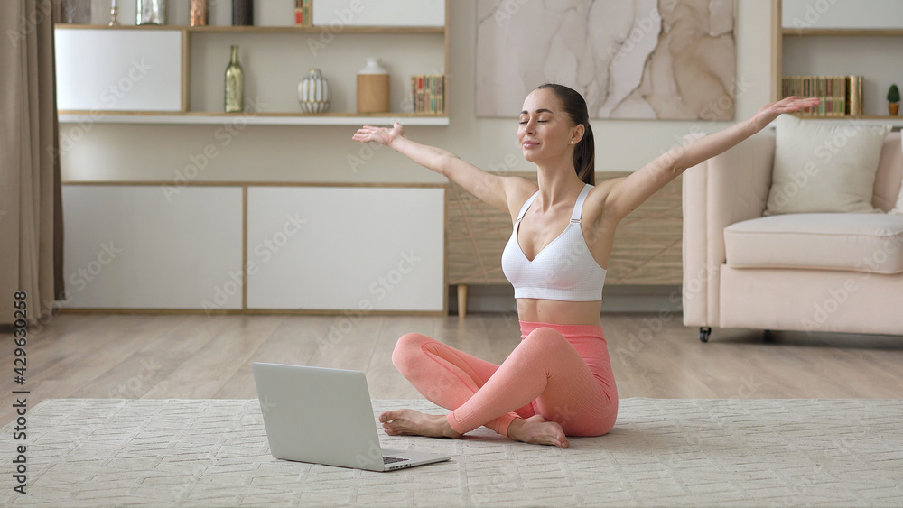 Female internet yoga teacher doing distant chat working from home talks to web camera making distance online video conference call, webinar education, healthcare and exercise, mental therapy concept Female internet yoga teacher doing distant chat working from home talks to web camera making distance online video conference call, webinar education, healthcare and exercise, mental therapy concept