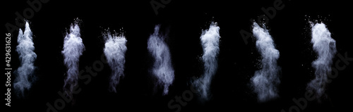 Freeze motion of white powder exploding, isolated on black, dark background. Abstract design of white dust cloud. Particles explosion screen saver, wallpaper with copy space. Planet creation concept