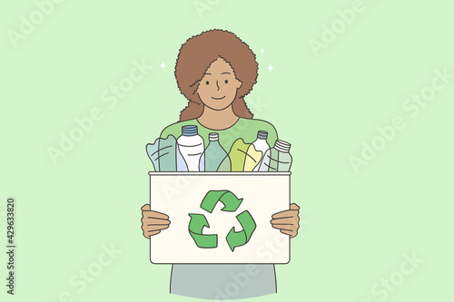 Recycling and sustainable lifestyle concept. Young smiling black woman cartoon character standing holding recycle bin with plastic bottles outdoors vector illustration 