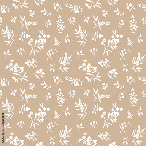 Vector seamless pattern. Pretty pattern in small flowers. Small white flowers. light beige background. Ditsy floral background. The elegant the template for fashion prints.