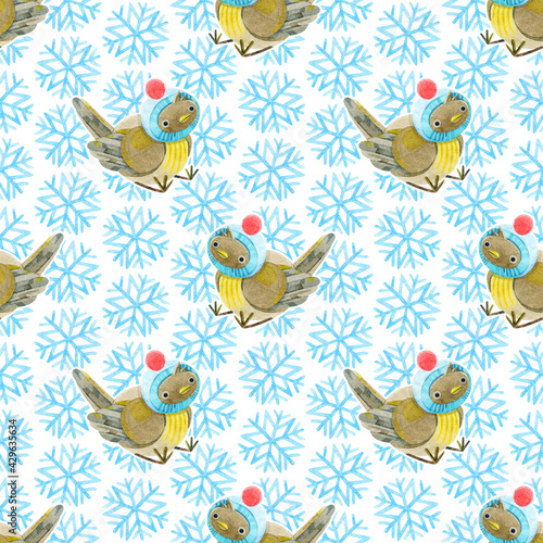 Seamless pattern of cute baby sparrows and snowflakes. Light background with blue snowflakes. Christmas pattern. Hand-drawn watercolor illustrations on a white background. For textile, wrapping.