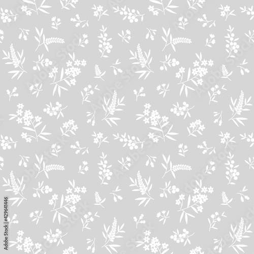 Floral pattern. Pretty flowers on light gray background. Printing with small white flowers. Ditsy print. Seamless vector texture. Spring bouquet. Stock vector.