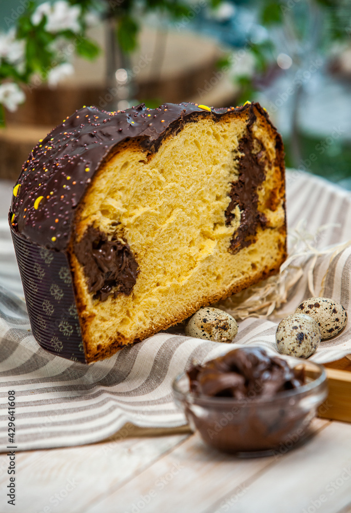 Panettone is the traditional Italian dessert for easter in 2021. Homemade panettone covered in chocolate and sprinkles. Bread served as dessert. Panettone is the traditional Italian dessert for easter in 2021. Homemade panettone covered in chocolate and sprinkles. Bread served as dessert.