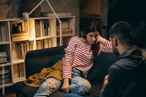 couple sitting at home arguing. relationship problem concept.