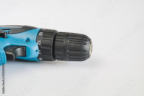 A blue cordless drill with battery pack for worker device tool.