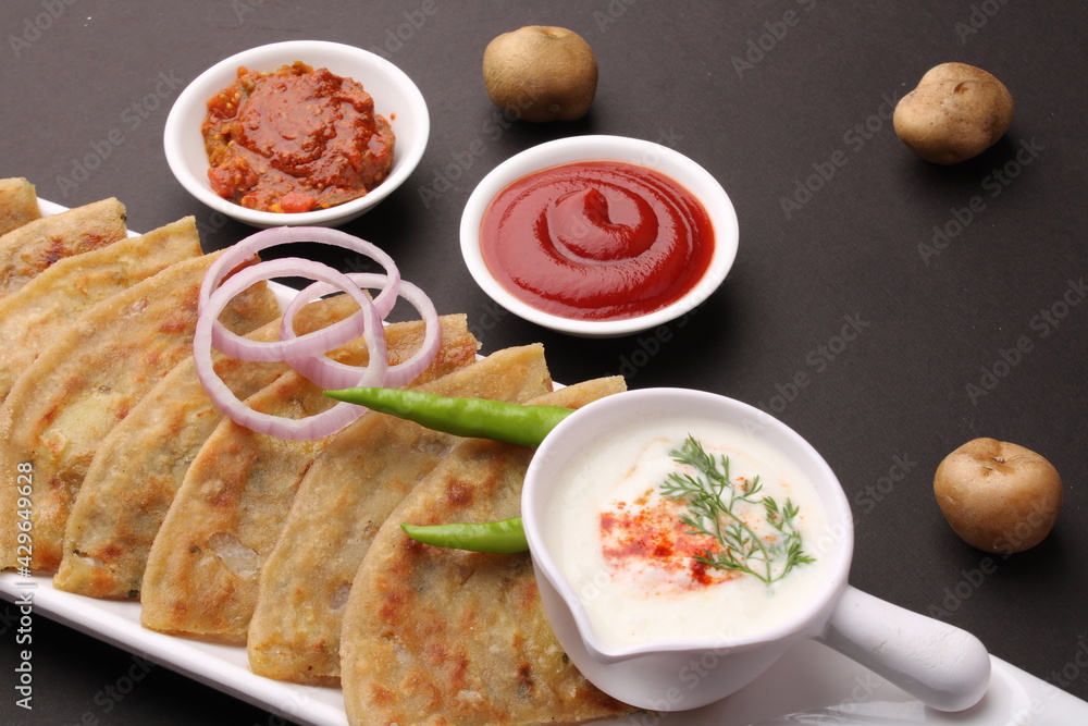 Traditional Indian food Aloo paratha or potato stuffed flat bread ...
