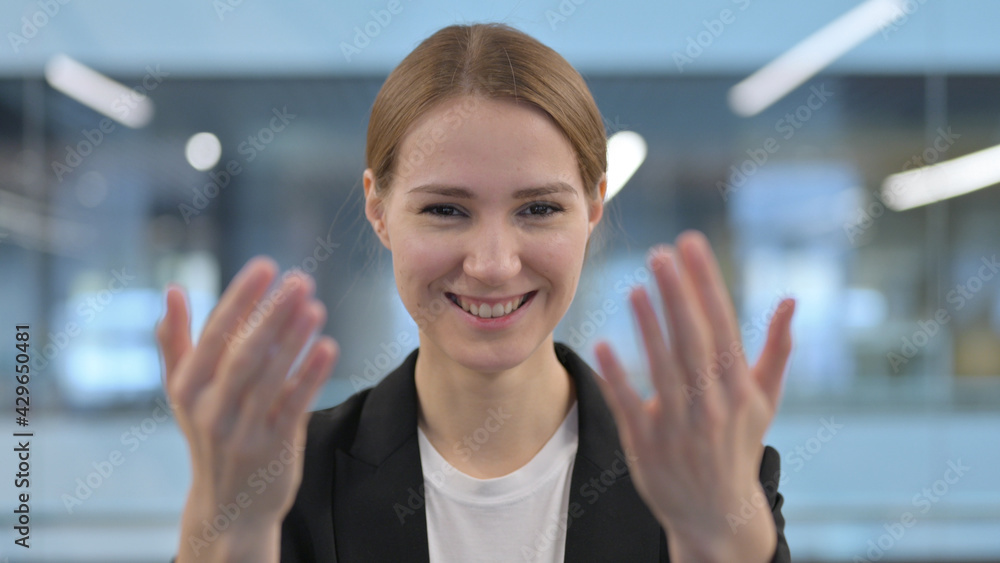 Portrait of Businesswoman Pointing at the Camera and Inviting 