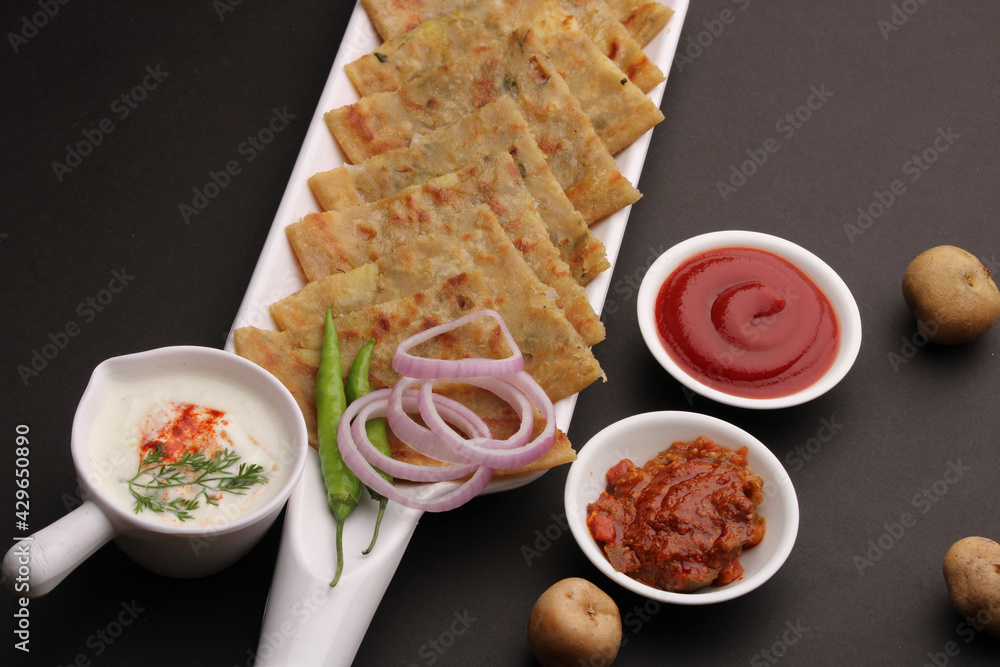 Traditional Indian food Aloo paratha or potato stuffed flat bread ...