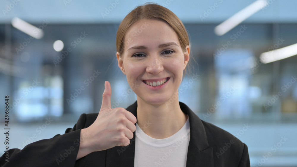 Portrait of Businesswoman showing Thumbs Up Sign 