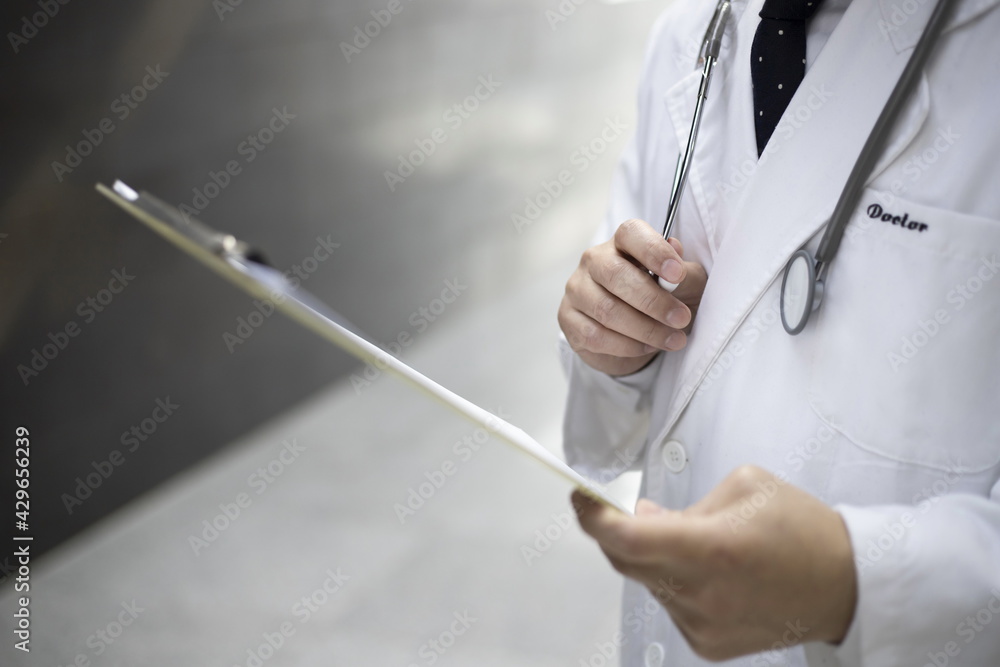 Close up of doctor reviewing medical chart