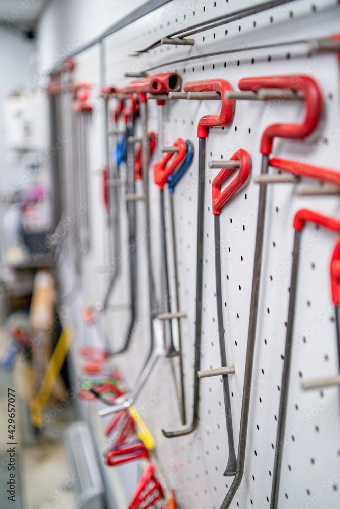 Fototapeta premium Paintless Dent Repair. Tools for car repair without painting in the workshop isolated static. Hammer, clips, machine, work, master, professionalism. High quality 4k footage