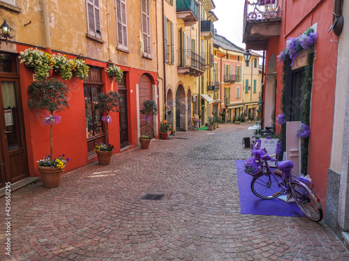 beautiful street in the historic center of Luino with flowers  lavender and porphyry