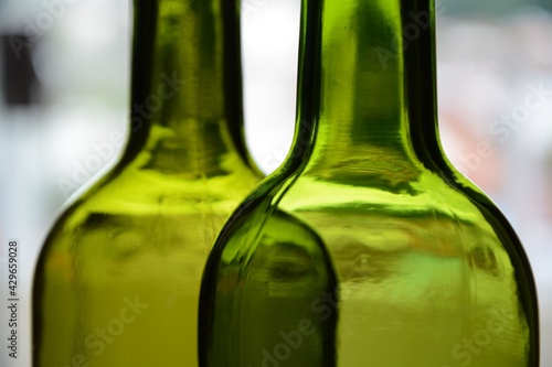 Green empty wine bottles.
