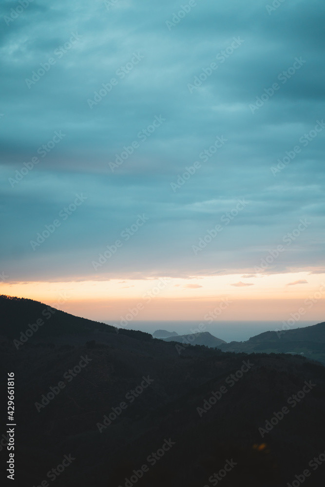 Sunset over the Basque Country coast on a cloudy day