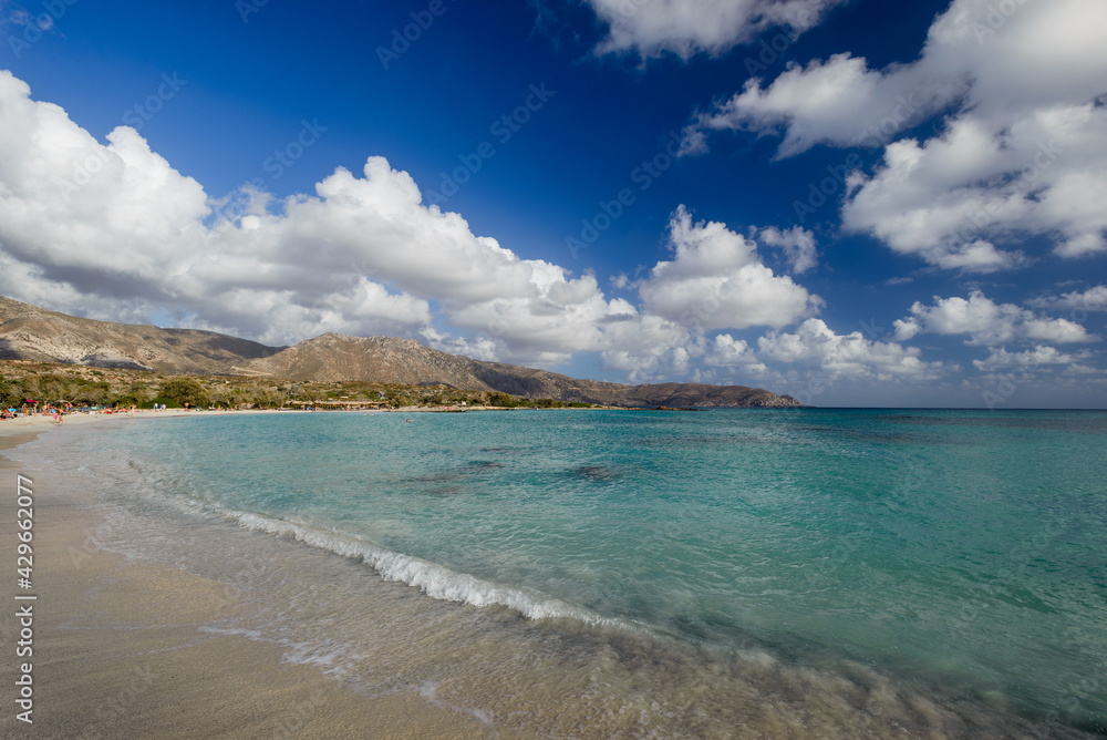 White clouds on blue sky turquoise sea water wave splashing
