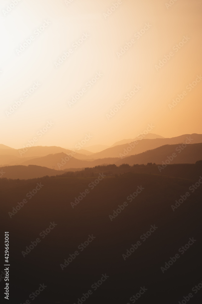 Fototapeta premium Golden light illuminating the hills of Basque Country