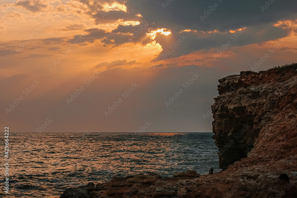 Beautiful view on a Black sea coast with mountains and sunset sky