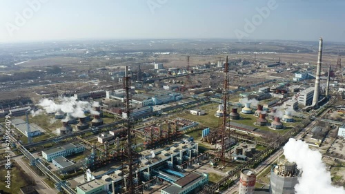 Wallpaper Mural Aerial view of large oil refinery facilities. Plant factory of petrochemical industry and chemical manufacturing. Fuel and power resources. Shot from drone. Industrial factory aerial Torontodigital.ca