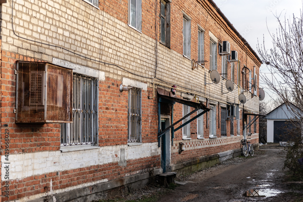 The village of Khanskaya. Russia. Winter 2020. Courtyard of an old apartment building. House on Krasnooktyabrskaya street.