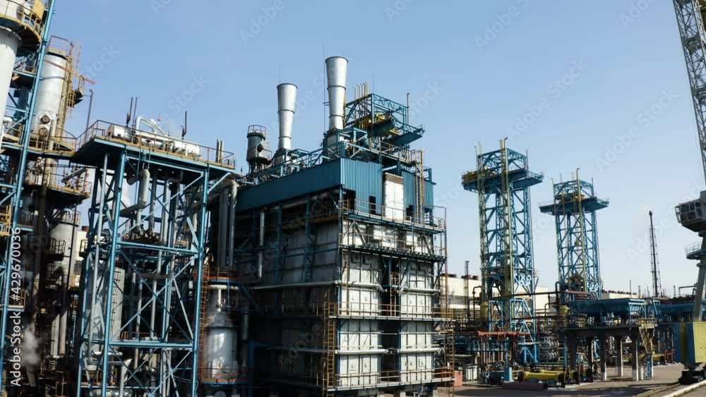 Aerial view of large oil refinery facilities. Plant factory of petrochemical industry and chemical manufacturing. Fuel and power resources. Shot from drone. Industrial factory aerial Aerial view of large oil refinery facilities. Plant factory of petrochemical industry and chemical manufacturing. Fuel and power resources. Shot from drone. Industrial factory aerial