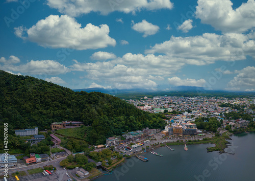 Kawaguchi lake and lakeside townscape under summer blue sky © Quang
