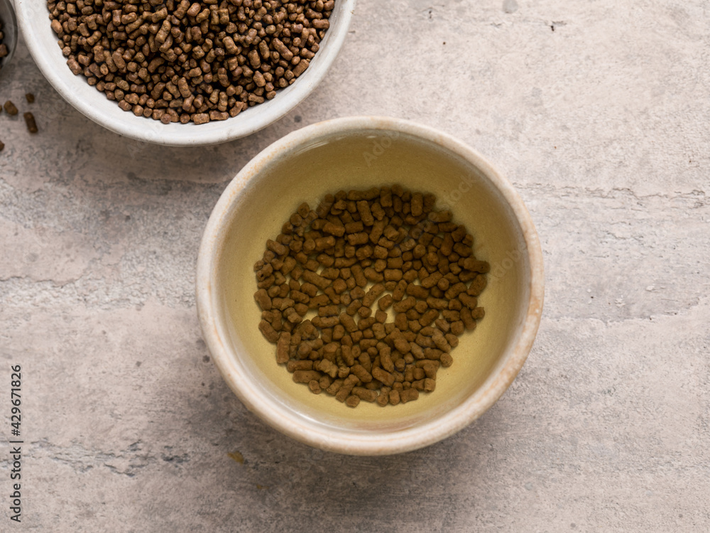 Top view of healthy soba tea and groats of tartary buckwheat Ku Qiao seeds on light background. Flat lay. Copy space Top view of healthy soba tea and groats of tartary buckwheat Ku Qiao seeds on light background. Flat lay. Copy space