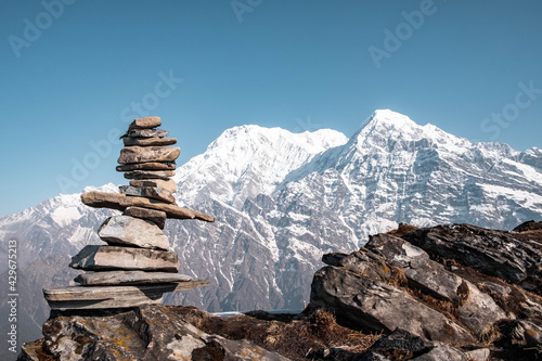 Annapurna south and stones pyramid. Early morning view on the Annapurna south and Huinсhuli mountains from the Mards Himal range.