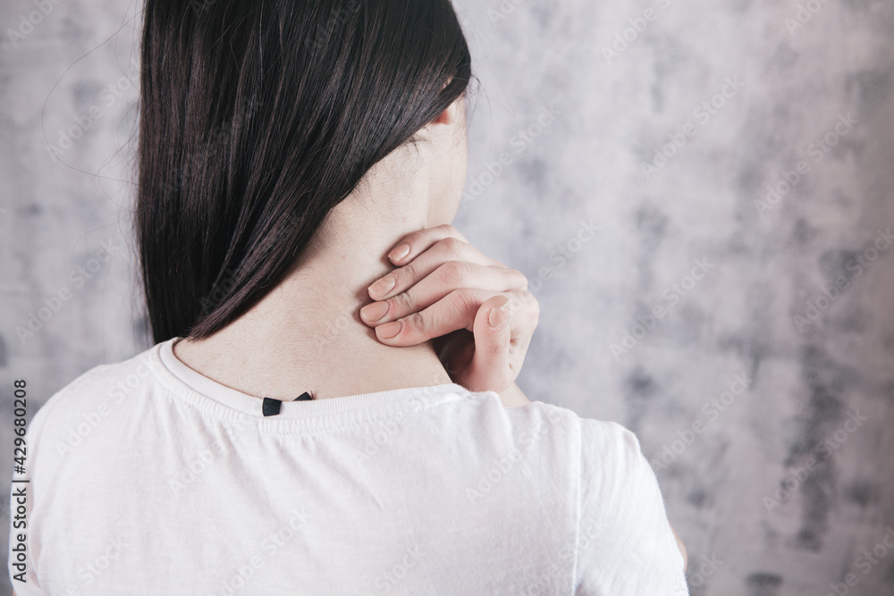 close-up on a woman's hand massaging her neck. Girl's neck hurts close-up on a woman's hand massaging her neck. Girl's neck hurts