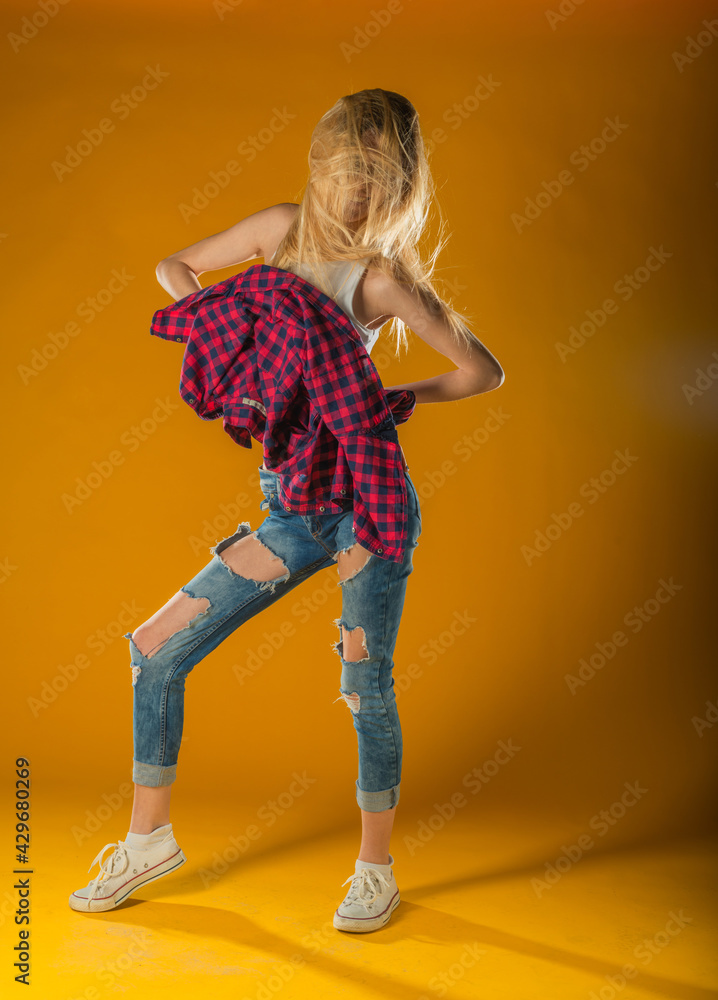Young Woman In Yellow Tanktop And Eye Glasses Against Yellow Background Young Woman In Yellow Tanktop And Eye Glasses Against Yellow Background