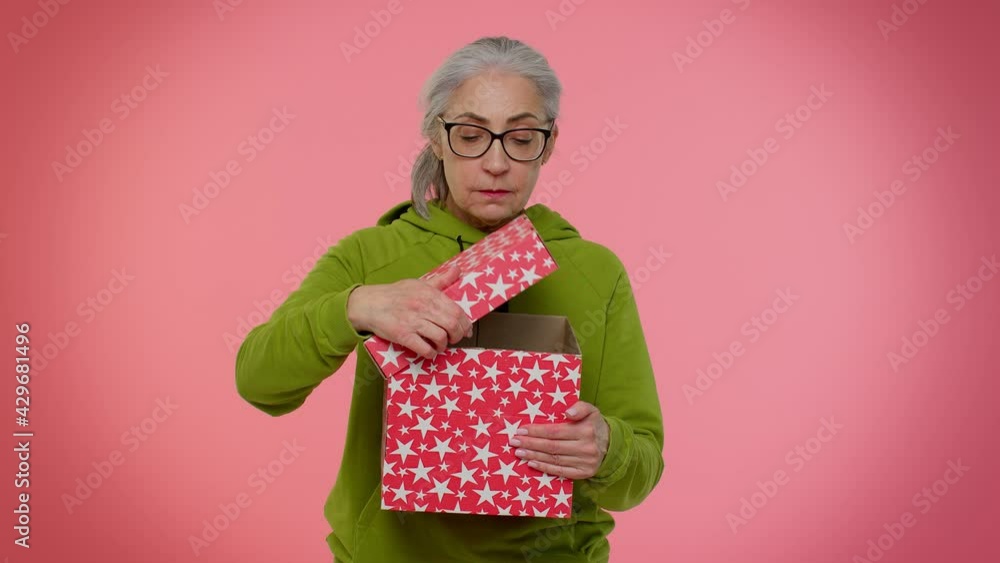 Elderly Granny Woman In Blue Hoodie Opening T Box Unwrapping Birthday Surprise And