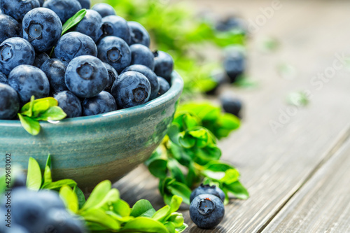 Fresh blueberries background with copy space for your text. Blueberry antioxidant organic superfood in a bowl concept for healthy eating and nutrition