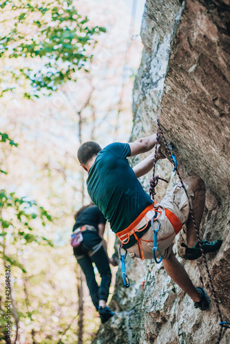 Climbing route on a rock wall with climbers