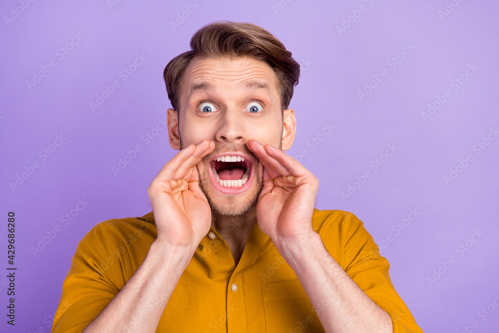 Portrait of impressed person arms near open mouth yell talk staring camera isolated on purple color background Portrait of impressed person arms near open mouth yell talk staring camera isolated on purple color background