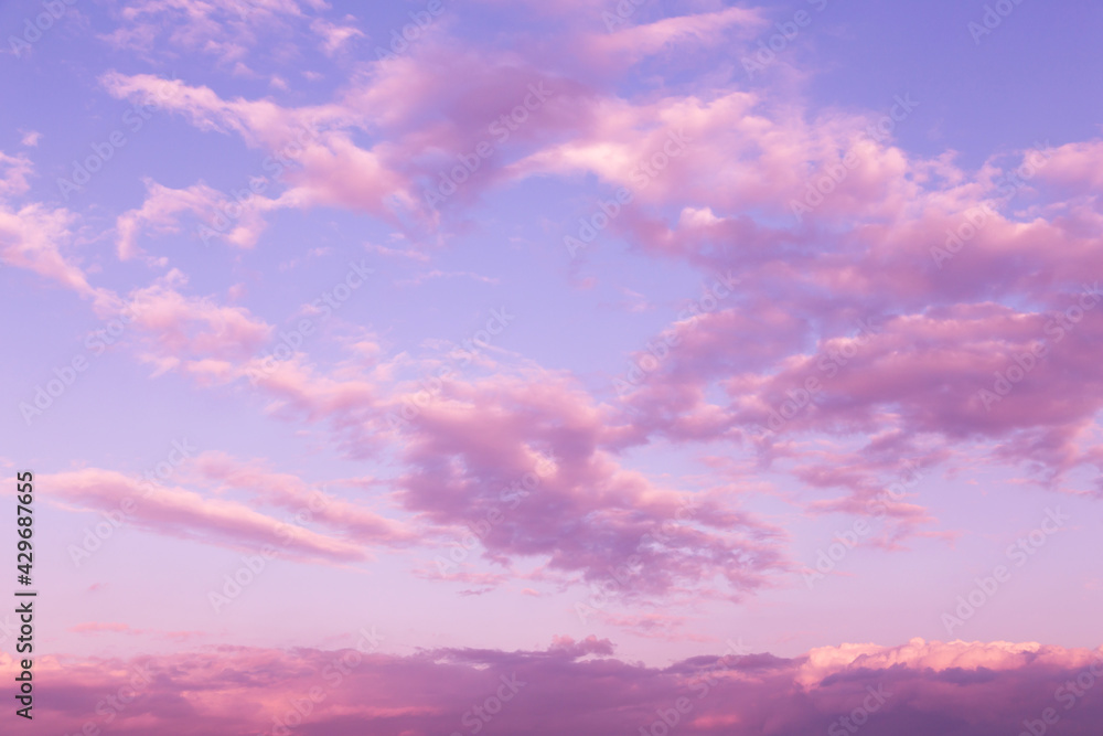 Sunrise, sunset pink violet blue sky with clouds abstract background texture