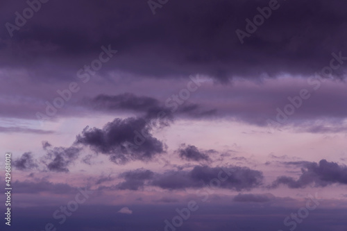 Epic Dramatic Storm sky with dark blue violet cumulus rainy clouds background texture, thunderstorm