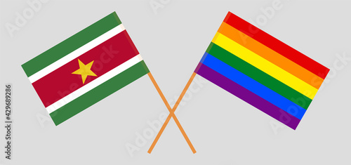 Crossed flags of Suriname and LGBTQ. Official colors. Correct proportion