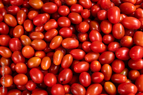 Bright red fresh ripe cherry tomatoes © Casa.da.Photo