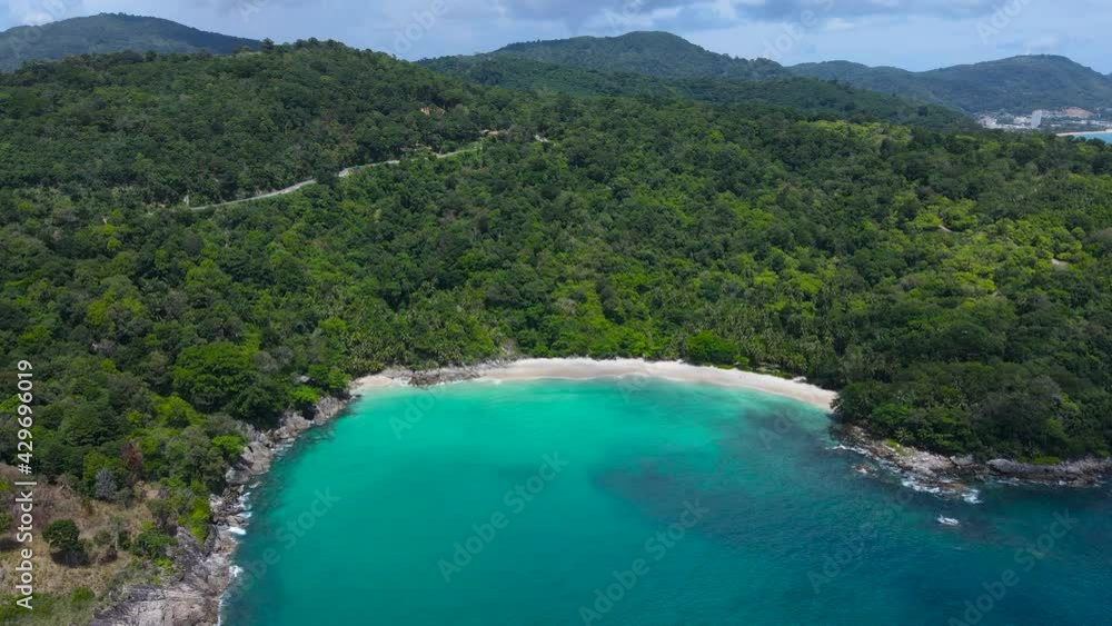 Professional Video. Aerial view shot. Drone camera over white beach sand and sew water clear. Nature video view of beautiful tropical beach and yacht at sea. Freedom beach. At Phuket, Thailand. Professional Video. Aerial view shot. Drone camera over white beach sand and sew water clear. Nature video view of beautiful tropical beach and yacht at sea. Freedom beach. At Phuket, Thailand.
