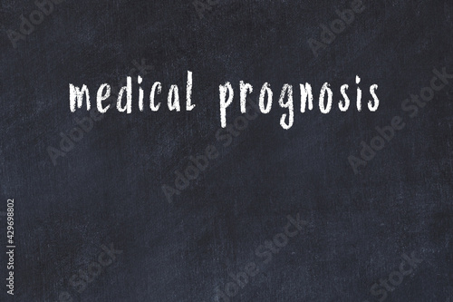 Fotografie Black chalkboard with inscription medical prognosis on in