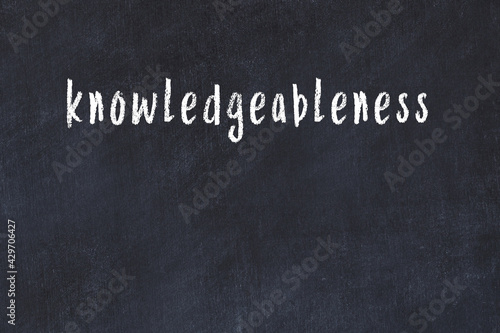 Black chalkboard with inscription knowledgeableness on in photo