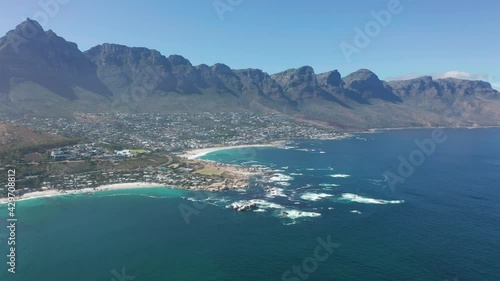 Aerial view. Shoreline of Camps Bay, Cape Town, South Africa, with Twelve Apostles mountains. CAPE TOWN, SOUTH AFRICA.