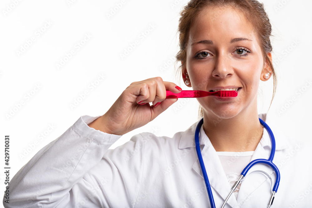 Dental nurse or dentist demonstrating brushing of teeth Dental nurse or dentist demonstrating brushing of teeth