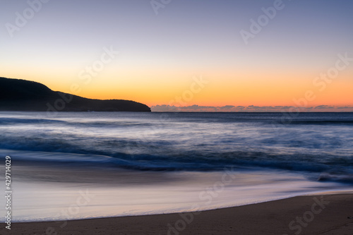 Sunrise at the seaside with clear skies © Merrillie