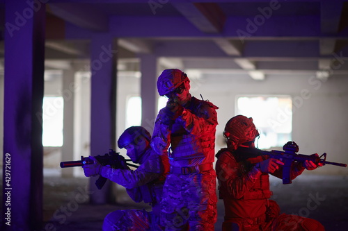 Soldiers squad in tactical formation having action urban environment