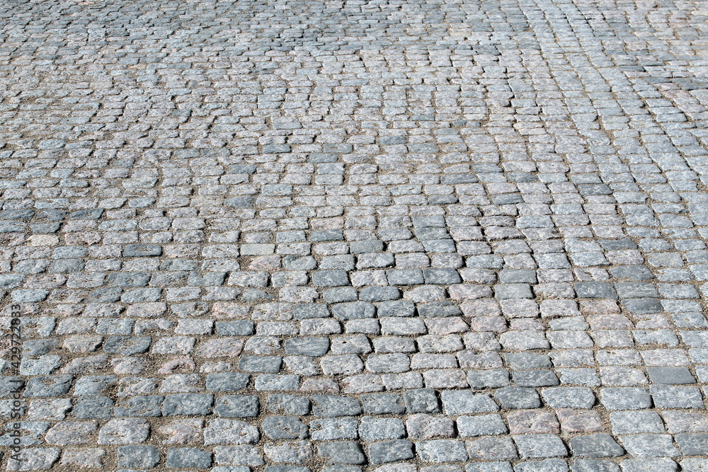 Ancient sidewalk lined with small natural stones