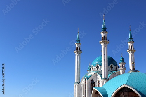 Mosque building on a bright blue background