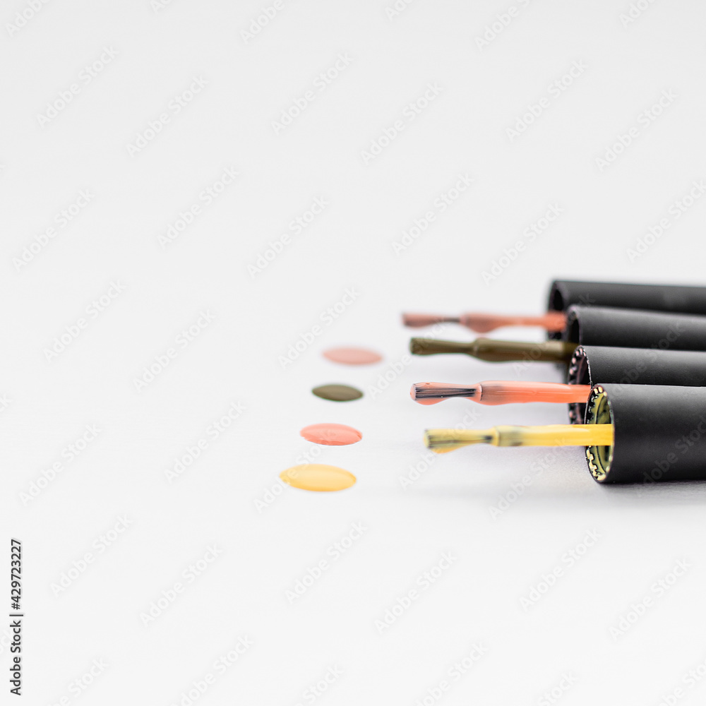 Nail polish on a white isolated background. Beauty and aesthetics Nail polish on a white isolated background. Beauty and aesthetics
