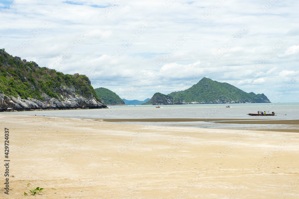 White Sandy Beach of Laem Sala beach which is Flanked On Three Sides By Dry Limestone Hills, Thailand.